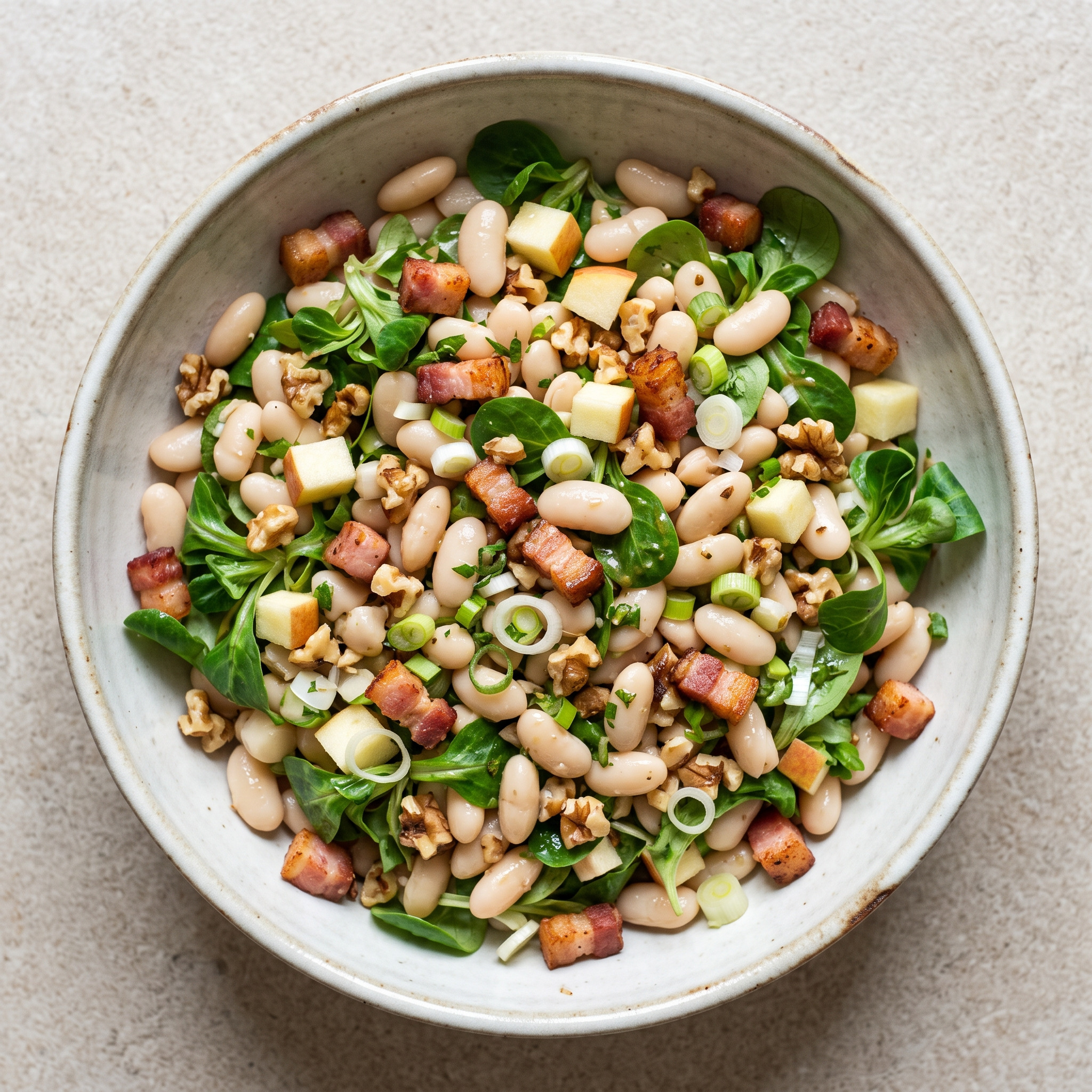 Salade de cocos de Paimpol mit Apfel und Speck